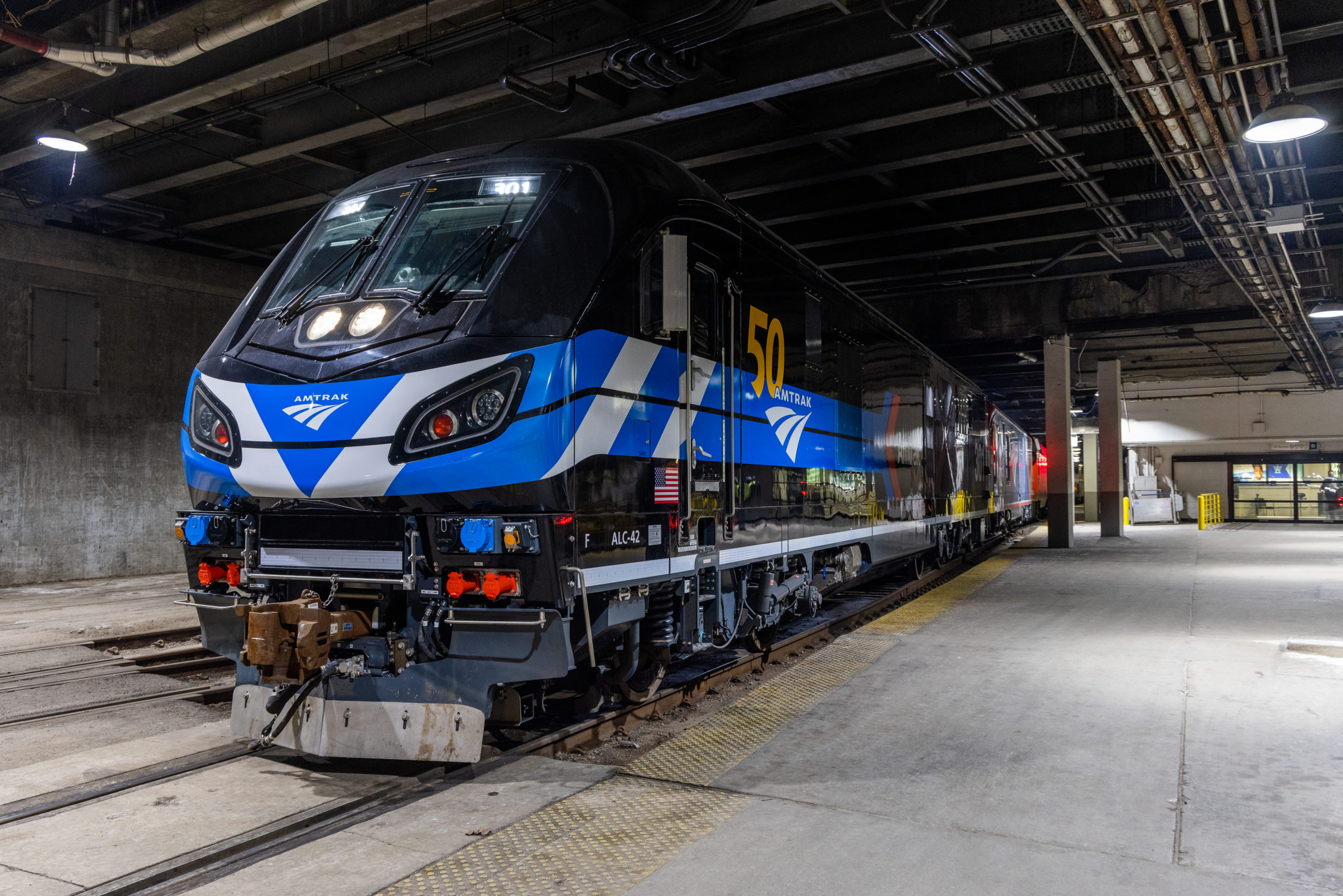 Photo of: Units 301 & 302 preparing to leave Amtrak Chicago Union Station on the "Empire Builder." // Amtrak